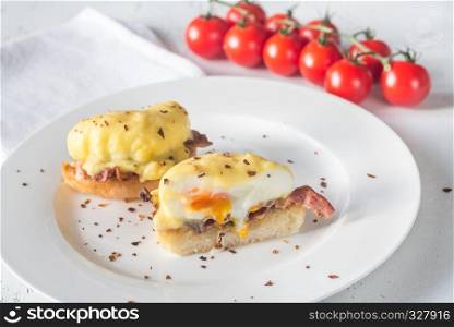 Eggs Benedict on the white plate