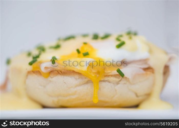 Eggs Benedict toasted English muffins ham poached eggs and delicious buttery hollandaise sauce