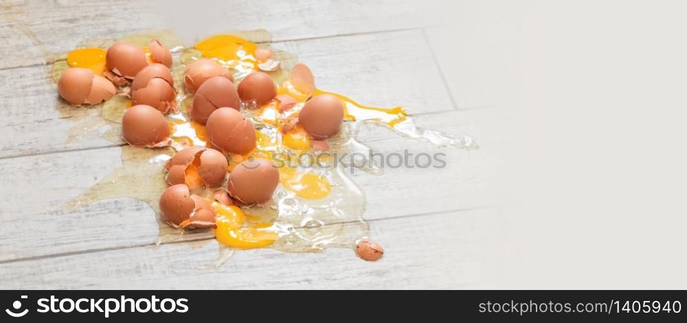 Eggs broken on the floor background