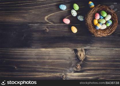 Eggs easter in the nest on wood background with copyspace.