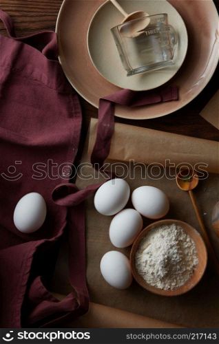 eggs, flour and utensils for cooking, flat lay. ingredients for cooking,