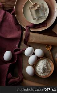eggs, flour and utensils for cooking, flat lay. ingredients for cooking,
