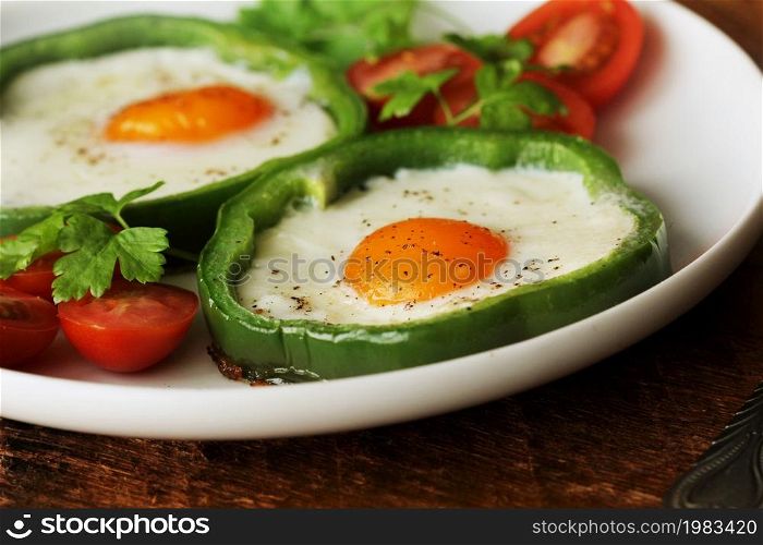 Eggs Fried in Bell Pepper Ring on wooden table. Eggs Fried in Bell Pepper Ring