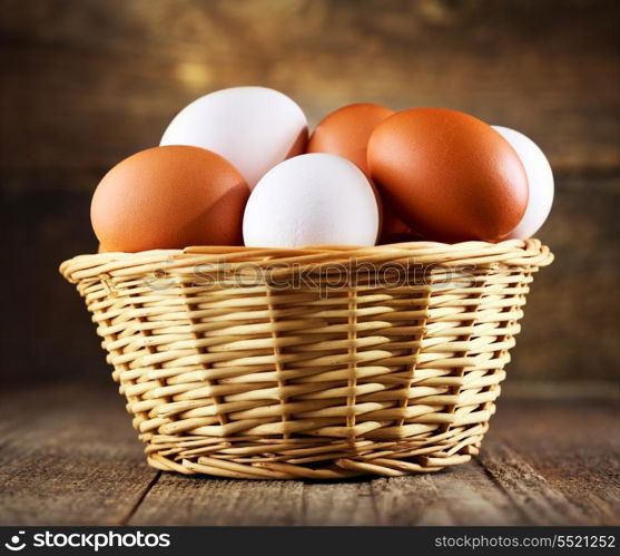 eggs in a basket on wooden table