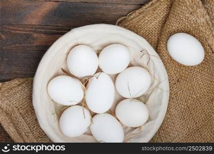 Eggs in a bowl on wooden table still life