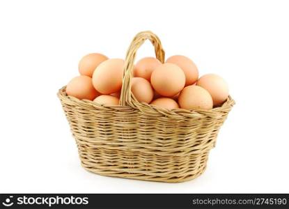 eggs in a traditional wicker basket isolated on white background