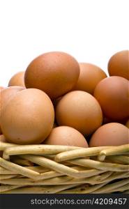 Eggs in basket on white background