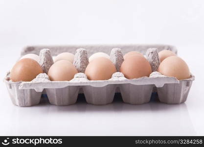 eggs in carton with white background