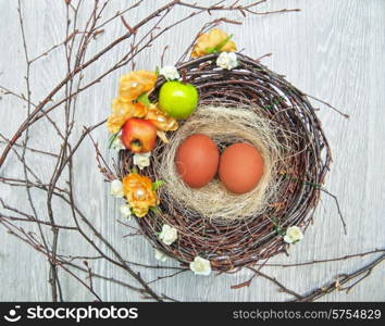 eggs in nest on a wooden background for easter. eggs in nest