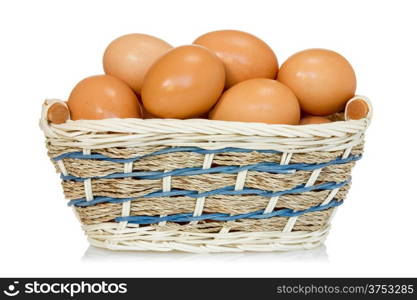 Eggs lay in a woven basket on the white background