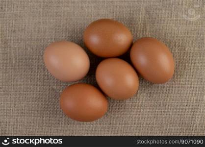 Eggs on the floor of hemp sacks. Top view.