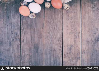 Eggs on the rustic wooden table with copy space. Eggs on textile