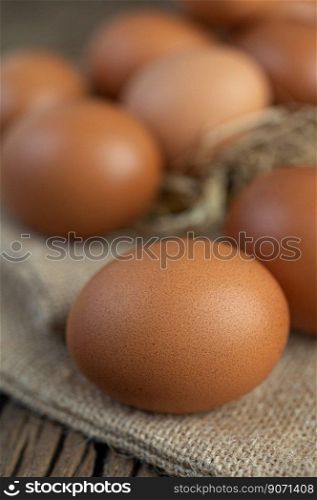 Eggs on the sacks, hemp on the wooden and straw. Selective focus