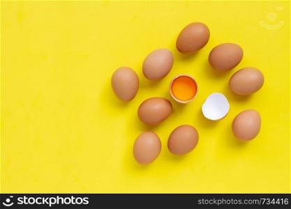 Eggs on yellow background. Copy space
