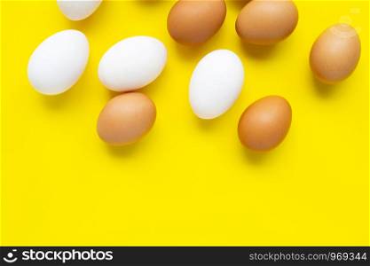 Eggs on yellow background. Top view