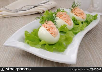 Eggs stuffed with salmon pate in lettuce leaves