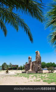 Egypt. Luxor. The Colossi of Memnon - two massive stone statues of Pharaoh Amenhotep III