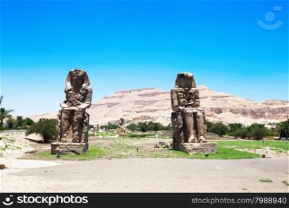 Egypt. Luxor. The Colossi of Memnon - two massive stone statues of Pharaoh Amenhotep III