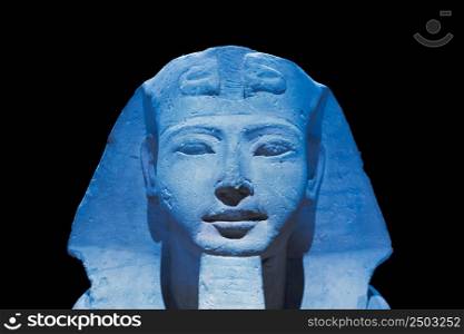 Egyptian archaeology. Ancient Sphinx in blue representing the pharaoh, copy space