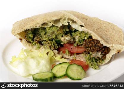 Egyptian flat bread stuffed with salad and falafels, a traditional fast food in the Middle East