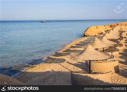 Egyptian parasols on the beach of Red Sea