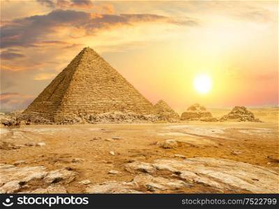 Egyptian pyramid in sand desert and clear sky. Egyptian pyramids in desert