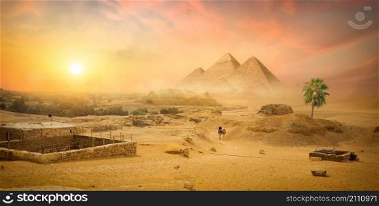 Egyptian pyramid in sand desert and clear sky. Pyramid in sand desert