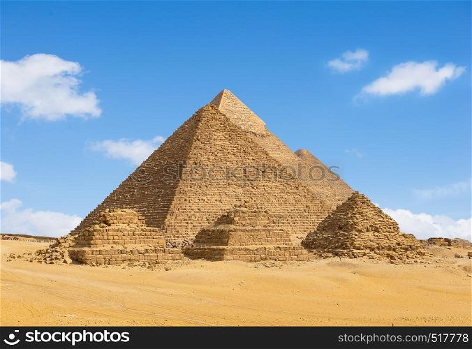 Egyptian pyramids in desert of Giza in a row