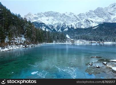 Eibsee lake winter view with thin layer of ice on the surface, Bavaria, Germany.