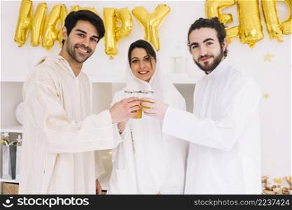 eid al fitr concept with friends drinking tea