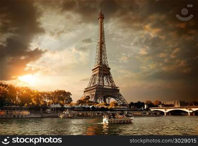Eiffel Tower and bridge Iena on the river Seine in Paris, France.. Clouds over Paris. Clouds over Paris