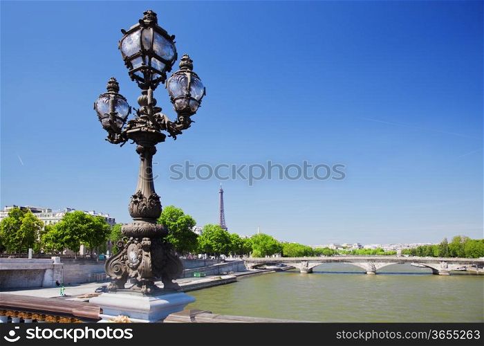 Eiffel Tower and bridge on Seine river in Paris, Fance. View from Alexandre Bridge at sunny day