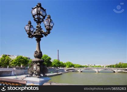 Eiffel Tower and bridge on Seine river in Paris, Fance. View from Alexandre Bridge at sunny day