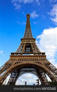 Eiffel Tower in Paris under blue sunny sky at France