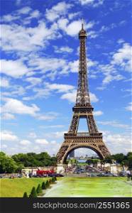 Eiffel tower on background of blue sky in Paris, France.