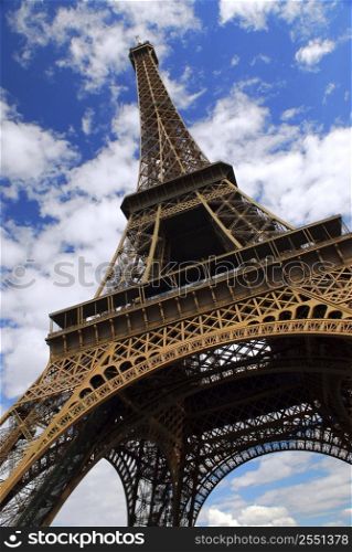 Eiffel tower on background of blue sky in Paris, France.