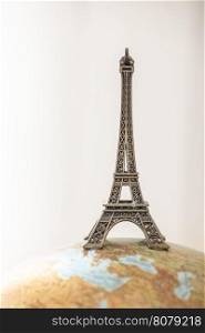 Eiffel Tower on globe. Miniature concept