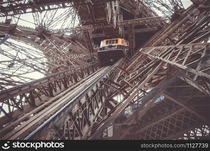 Eiffel Tower structure and elevator view from inside, Paris, France. Eiffel Tower structure and elevator, Paris, France