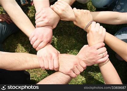 Eight friends have crossed hands