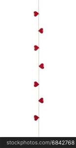 Eight hearts with clothes pegs on a cord, isolated on white