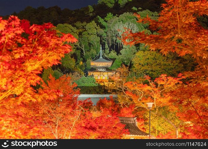Eikando Zenrinji Temple and wooden bridge with red maple leaves or fall foliage in autumn season. Colorful trees, Kyoto, Japan. Nature landscape background.