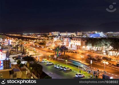 eilat,ISrael,20-march-2019: the lights on the city of Eilat in ISrael with on the left the old airport landing strip of the eilat agaba airport. eilat israel city by night