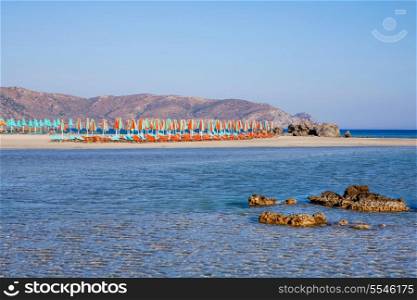 Elafonisos beach with umbrellas and sun loungers on the south-west coast of Crete, Greece. It is rated one of the best beaches in all of Europe and is a protected nature reserve.