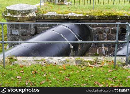 Elan Aqueduct ? 73 mile pipeline taking water from the Elan Valley reservoirs, Wales, over the River Severn to Birmingham. Black pipe.