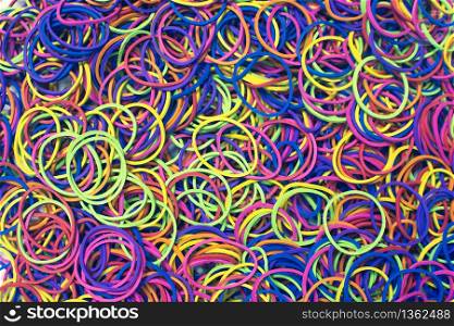 Elastic rubber band with colorful texture background.