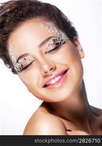 Elated young woman smiling with closed eyes - pleasure and bliss. Sensuality and charming