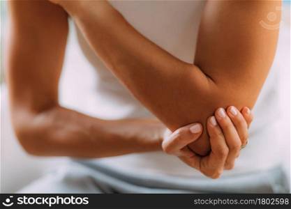 Elbow pain. Woman with painful elbow.. Elbow Pain