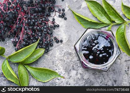 Elderberry jam and fresh berries.Homemade pozzy.Marmalade or confiture. Elderberry autumn jam
