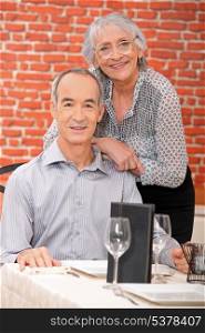 Elderly couple at restaurant
