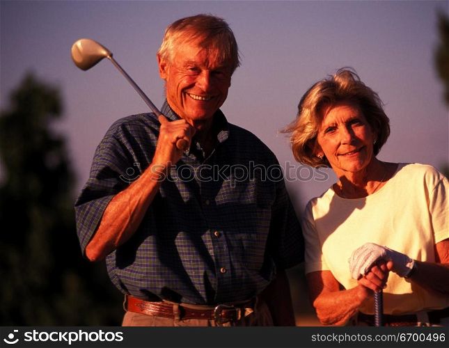 elderly couple at the golf course